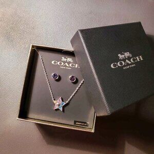 NWT Coach jewelry set.